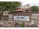 Elegant entrance to the Presidio Residents Club, showcasing beautiful stonework and lush greenery at 17762 W Granite View Dr, Goodyear, AZ 85338