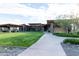 Modern community center with lawn, open-air dining, and well-manicured desert landscape at 17762 W Granite View Dr, Goodyear, AZ 85338