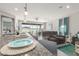 Modern kitchen island with granite countertops overlooking the adjacent living area and outdoor space at 17762 W Granite View Dr, Goodyear, AZ 85338