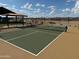 Outdoor community pickleball court surrounded by desert landscaping and open sky at 17978 W Camino De Oro --, Surprise, AZ 85387