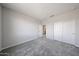 Inviting bedroom with soft carpeting, neutral decor, and a closet, perfect for rest and relaxation at 17989 W Camino De Oro --, Surprise, AZ 85387