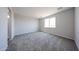 Bedroom features neutral color scheme, carpet flooring, and window at 17989 W Camino De Oro --, Surprise, AZ 85387