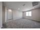 Expansive loft area with plush carpeting, natural light, and ample space for flexible living at 17989 W Camino De Oro --, Surprise, AZ 85387