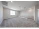 Bright loft space with neutral color scheme, window, and carpet flooring at 17989 W Camino De Oro --, Surprise, AZ 85387