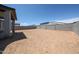 View of the expansive backyard with block wall fencing, ready for custom landscaping at 17996 W Camino De Oro --, Surprise, AZ 85387