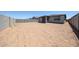 Expansive backyard with block fence, providing privacy and room for a custom outdoor space at 17996 W Camino De Oro --, Surprise, AZ 85387