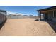 Spacious backyard area with block fencing, ready for landscaping and outdoor activities at 17996 W Camino De Oro --, Surprise, AZ 85387