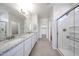 Bathroom featuring double sinks, granite countertops, walk-in shower, tile flooring at 17996 W Camino De Oro --, Surprise, AZ 85387