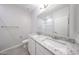 Bathroom featuring a double vanity with a solid surface countertop at 17996 W Camino De Oro --, Surprise, AZ 85387