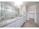 Bathroom featuring double sinks, granite countertops, walk-in shower, tile flooring at 17996 W Camino De Oro --, Surprise, AZ 85387