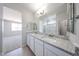 Bathroom featuring double sinks, granite countertops, walk-in shower, tile flooring at 17996 W Camino De Oro --, Surprise, AZ 85387