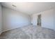 Spacious bedroom featuring neutral walls, carpet and view to bathroom at 17996 W Camino De Oro --, Surprise, AZ 85387