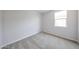This bedroom offers neutral carpet, paint and trim, plus a window at 17996 W Camino De Oro --, Surprise, AZ 85387