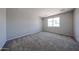 Neutral bedroom with carpet and a window providing natural light at 17996 W Camino De Oro --, Surprise, AZ 85387