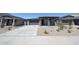 Attractive single-story home with a well-manicured front yard and a cozy front porch at 17996 W Camino De Oro --, Surprise, AZ 85387