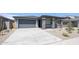 Charming single-story home with a stone-accented porch and a spacious driveway at 17996 W Camino De Oro --, Surprise, AZ 85387