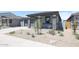 Beautiful single-story home with a stone-accented porch and drought-tolerant landscaping at 17996 W Camino De Oro --, Surprise, AZ 85387