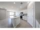 Bright kitchen features white cabinets, gray backsplash, stainless appliances, and granite countertops at 17996 W Camino De Oro --, Surprise, AZ 85387