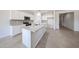 Modern kitchen with granite countertops, stainless steel appliances, and a center island at 17996 W Camino De Oro --, Surprise, AZ 85387
