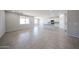 Bright, open-concept living space with tile flooring and plenty of natural light at 17996 W Camino De Oro --, Surprise, AZ 85387