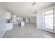 Bright living space with an open floor plan, tile flooring, and a view to the backyard at 17996 W Camino De Oro --, Surprise, AZ 85387