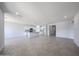 Spacious open-plan living area featuring tile floors and modern recessed lighting at 17996 W Camino De Oro --, Surprise, AZ 85387