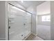 Bathroom shower featuring glass door and built-in shelving at 17996 W Camino De Oro --, Surprise, AZ 85387