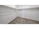 Walk-in closet with carpeted floor and built-in shelving at 17996 W Camino De Oro --, Surprise, AZ 85387