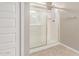 Bathroom features a glass-enclosed shower with tile surround, creating a clean and modern design at 18800 W Madison St, Buckeye, AZ 85326