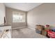 Bedroom with carpet, a window, and neutral tones provides a blank canvas for personalization at 18800 W Madison St, Buckeye, AZ 85326