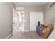 Bedroom with carpet flooring and sliding door closet, and an open view to other rooms at 18800 W Madison St, Buckeye, AZ 85326