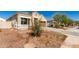 Charming single-story home featuring a two-car garage and low-maintenance landscaping at 18800 W Madison St, Buckeye, AZ 85326