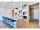 Kitchen with pendant lighting, a large center island with bar seating, and modern stainless steel appliances at 1940 W Kinfield Trl, Phoenix, AZ 85085