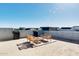 Rooftop deck with lounge furniture and planters, perfect for entertaining with a view at 1940 W Kinfield Trl, Phoenix, AZ 85085