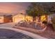 Beautiful single-story home with a desert landscape and a cozy front patio at 20151 N Riverbank Rd, Maricopa, AZ 85138