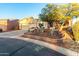 Beautiful single-story home with a desert landscape and a cozy front patio at 20151 N Riverbank Rd, Maricopa, AZ 85138