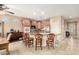 Spacious kitchen featuring granite countertops, a breakfast bar, and stainless steel appliances at 20151 N Riverbank Rd, Maricopa, AZ 85138