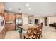 Well-lit kitchen with a breakfast bar, granite countertops, and stainless steel appliances at 20151 N Riverbank Rd, Maricopa, AZ 85138