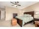 Comfortable main bedroom with a large bed, soft carpet, and ample natural light at 20151 N Riverbank Rd, Maricopa, AZ 85138