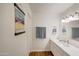 A bright bathroom features a long vanity with drawers and a decorative painting at 2025 E Campbell Ave # 227, Phoenix, AZ 85016