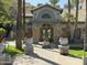 Attractive community building entrance with stone accents, lush landscaping, and a welcoming facade at 2025 E Campbell Ave # 227, Phoenix, AZ 85016