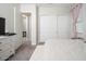 Bedroom showcasing sliding closet doors and a neutral palette, offering a serene and uncluttered space at 21150 W Minnezona Ave, Buckeye, AZ 85396