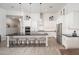 Beautiful kitchen featuring white cabinets, subway tile backsplash, and a large island with seating at 21150 W Minnezona Ave, Buckeye, AZ 85396