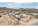 Wide aerial view of a home with desert surroundings and mountain backdrop at 21621 W Narramore Rd, Buckeye, AZ 85326