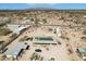 Expansive aerial view of desert property featuring solar panels and a detached garage at 21621 W Narramore Rd, Buckeye, AZ 85326