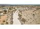 Aerial view of a home in a rural community surrounded by desert landscape at 21621 W Narramore Rd, Buckeye, AZ 85326