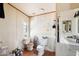 Unique bathroom featuring a white vanity, two toilets, and a small window at 21621 W Narramore Rd, Buckeye, AZ 85326