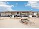 Ranch-style home featuring solar panels and a covered patio area with desert landscaping at 21621 W Narramore Rd, Buckeye, AZ 85326