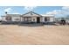 One-story house with front porch and dirt yard at 21621 W Narramore Rd, Buckeye, AZ 85326