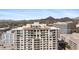 Modern luxury building with rooftop terrace and mountain views, offering stylish city living at 2211 E Camelback Rd # 601, Phoenix, AZ 85016